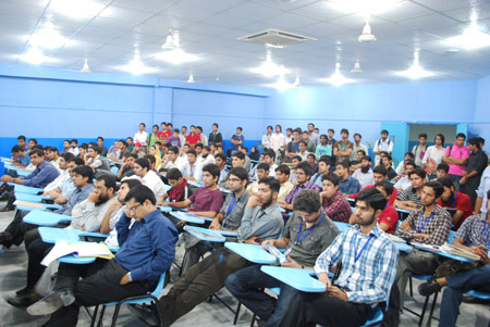 Students throng the seminar room to listen to Ali Malik