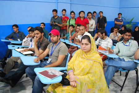 A view of the audience listening to Ali Malik